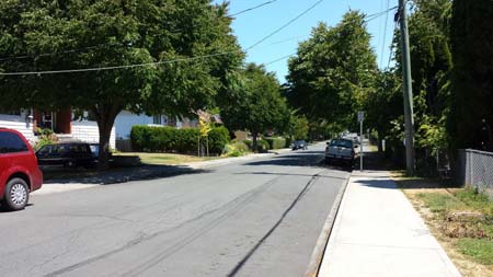 Residential street with blue sky