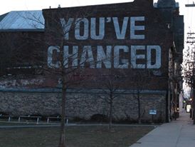 painted sign on building with youve-changed